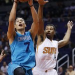 Charlotte Hornets' Jeremy Lin (7) drives past Phoenix Suns' Ronnie Price, right, during the first half of an NBA basketball game Wednesday, Jan. 6, 2016, in Phoenix. (AP Photo/Ross D. Franklin)