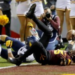 Arizona State wide receiver Devin Lucien (15) falls into the end zone for a touchdown during the first half of the Cactus Bowl NCAA college football game against West Virginia, Saturday, Jan. 2, 2016, in Phoenix. (AP Photo/Matt York)