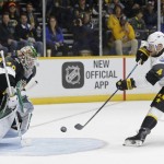 Pacific Division forward Taylor Hall (4), of the Edmonton Oilers, scores against Central Division goalie Devan Dubnyk (40), of the Minnesota Wild, during an NHL hockey All-Star semifinal round game Sunday, Jan. 31, 2016, in Nashville, Tenn. The Pacific Division won 9-6 to move onto the championship game. (AP Photo/Mark Humphrey)