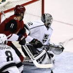Arizona Coyotes' Oliver Ekman-Larsson, of Sweden, sends the puck past Los Angeles Kings' Jonathan Quick, right, for a goal as Coyotes' Martin Hanzal (11), of the Czech Republic, and Kings' Drew Doughty (8) watch during the second period of an NHL hockey game Saturday, Jan. 23, 2016, in Glendale, Ariz. (AP Photo/Ross D. Franklin)