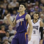 Phoenix Suns guard Devin Booker, pumps his fist after scoring against the Sacramento Kings during the first half of an NBA basketball game, Saturday, Jan. 2, 2016, in Sacramento, Calif.(AP Photo/Rich Pedroncelli)