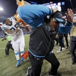 Carolina Panthers head coach Ron Rivera is dunked after the NFL football NFC Championship game against the Arizona Cardinals Sunday, Jan. 24, 2016, in Charlotte, N.C. The Panthers won 49-15 to advance to the Super Bowl. (AP Photo/David J. Phillip)