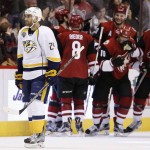 Nashville Predators' Eric Nystrom, left, skates off the ice as Arizona Coyotes' Anthony Duclair (10) celebrates his goal with Connor Murphy (5), Tobias Rieder (8) and Martin Hanzal (11), during the third period of an NHL hockey game Saturday, Jan. 9, 2016, in Glendale, Ariz.  The Coyotes defeated the Predators 4-0. (AP Photo/Ross D. Franklin)