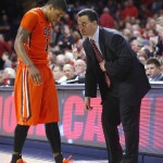 Oregon State guard Gary Payton II, left, talks with coach Sean Miller during the second half of an NCAA college basketball game against Oregon State, Saturday, Jan. 30, 2016, in Tucson, Ariz. Arizona defeated Oregon State 80-63. (AP Photo/Rick Scuteri)