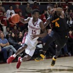 Stanford guard Marcus Allen (15) dribbles past Arizona State guard Gerry Blakes (4) during the second half of an NCAA college basketball game Saturday, Jan. 23, 2016, in Stanford, Calif. Stanford won 75-73. (AP Photo/Marcio Jose Sanchez)