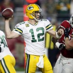Green Bay Packers quarterback Aaron Rodgers (12) throws against the Arizona Cardinals during the first half of an NFL divisional playoff football game, Saturday, Jan. 16, 2016, in Glendale, Ariz. (AP Photo/Rick Scuteri)