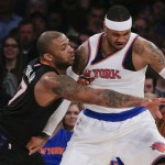 Phoenix Suns forward P.J. Tucker, left, tries to strip the ball from New York Knicks forward Carmelo Anthony during the first quarter of an NBA basketball game Friday, Jan. 29, 2016, in New York. (AP Photo/Julie Jacobson)