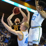 Arizona State's Eric Jacobsen (21) goes to the basket against UCLA's Thomas Welsh, bottom left, and Tony Parker (23) in the first half of an NCAA college basketball game in Los Angeles, Saturday, Jan. 9, 2016. (AP Photo/Michael Owen Baker)