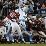 Carolina Panthers' Cam Newton dives into the end zone for a touchdown during the first half the NFL football NFC Championship game against the Arizona Cardinals, Sunday, Jan. 24, 2016, in Charlotte, N.C. (AP Photo/Mike McCarn)