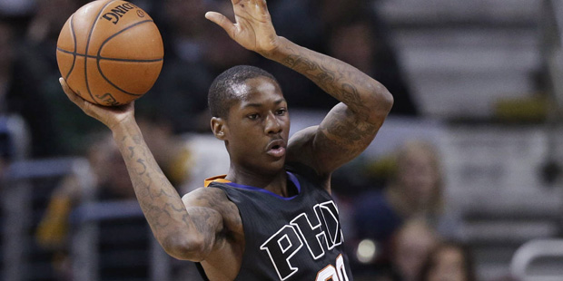 Phoenix Suns' Archie Goodwin (20) passes over Cleveland Cavaliers' Kyrie Irving (2) during the firs...