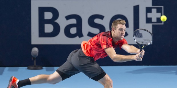 US player Jack Sock returns a ball to Switzerland's Roger Federer during their semifinal match at t...