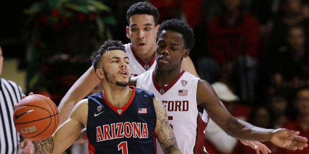 Arizona guard Gabe York (1) dribbles next to Stanford guard Marcus Allen during the second half of ...