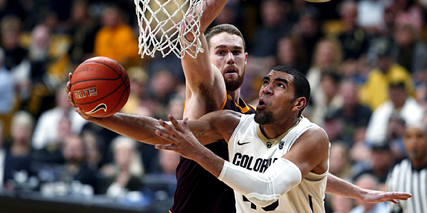 Colorado forward Josh Scott, front, drives past Arizona State forward Eric Jacobsen for a basket in...