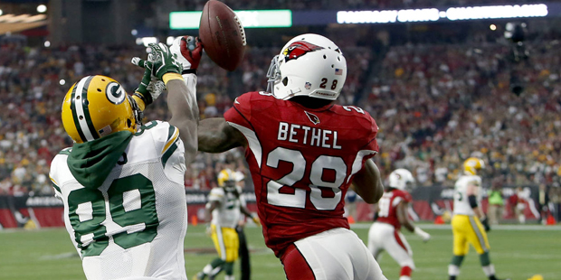 Arizona Cardinals cornerback Justin Bethel (28) intercepts a pass intended for Green Bay Packers wide receiver James Jones (89) in the end zone during the first half of an NFL football game, Sunday, Dec. 27, 2015, in Glendale, Ariz. (AP Photo/Rick Scuteri)