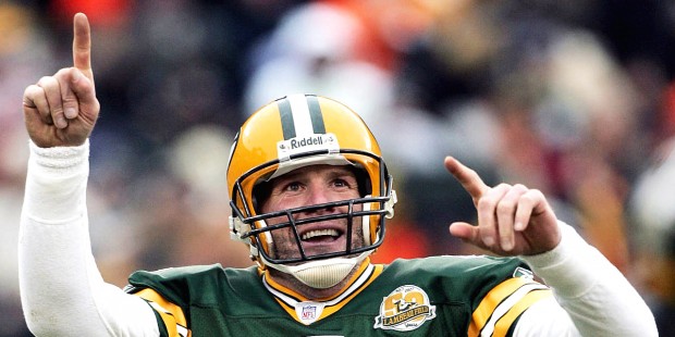 FILE - In this Dec. 9, 2007  file photo, Green Bay Packers quarterback Brett Favre reacts to a 46-y...