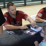 Chris Owings signs an autograph for a young fan at D-backs Fan Fest, Saturday, February 20, 2016 at Chase Field in Phoenix. (Photo: Vince Marotta/Arizona Sports)