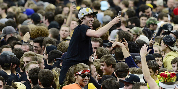 Colorado fans celebrate after the team's NCAA college basketball game against Arizona on Wednesday,...