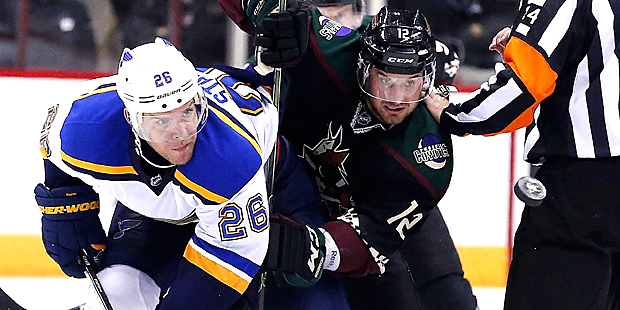 St. Louis Blues' Paul Stastny (26) and Arizona Coyotes' Brad Richardson (12) watch the puck during ...