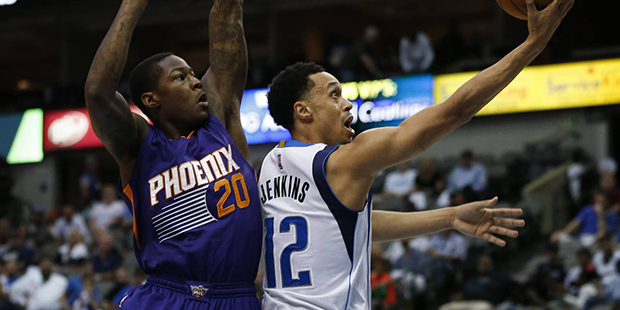 Dallas Mavericks guard John Jenkins (12) shoots in front of Phoenix Suns' Archie Goodwin (20) durin...