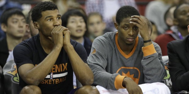 Phoenix Suns' Ronnie Price, left, and  Brandon Knight, endure the closing moments of the Suns' 142-...