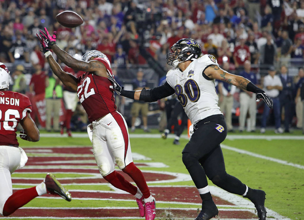 Arizona Cardinals strong safety Tony Jefferson (22) intercepts a  throw intended for Baltimore Ravens tight end Crockett Gillmore (80) in the end zone during the final seconds the second half of an NFL football game, Monday, Oct. 26, 2015, in Glendale, Ariz. The Cardinals won 26-18. (AP Photo/Rick Scuteri)