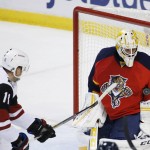 Arizona Coyotes center Martin Hanzal (11) attempts a shot at Florida Panthers goalie Roberto Luongo (1) during the first period of an NHL hockey game, Thursday, Feb. 25, 2016 in Sunrise, Fla. (AP Photo/Wilfredo Lee)
