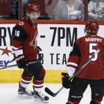 Arizona Coyotes' Max Domi (16) celebrates his second goal against the Dallas Stars during the second period of an NHL hockey game, with teammate Connor Murphy (5)m Thursday, Feb. 18, 2016, in Glendale, Ariz. (AP Photo/Ross D. Franklin)