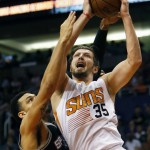 Phoenix Suns forward Mirza Teletovic (35) drives on San Antonio Spurs forward Kyle Anderson in the first quarter during an NBA basketball game, Sunday, Feb. 21, 2016, in Phoenix. (AP Photo/Rick Scuteri)