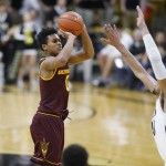 Arizona State guard Tra Holder, left, takes a 3-point shot over Colorado forward Josh Scott in the first half of an NCAA college basketball game Sunday, Feb. 28, 2016, in Boulder, Colo. (AP Photo/David Zalubowski)