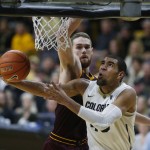 Colorado forward Josh Scott, front, drives past Arizona State forward Eric Jacobsen for a basket in the second half of an NCAA college basketball game Sunday, Feb. 28, 2016, in Boulder, Colo. Colorado won 79-69. (AP Photo/David Zalubowski)