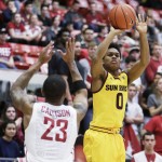 Arizona State's Tra Holder (0) shoots against Washington State's Charles Callison (23) during the first half of an NCAA college basketball game, Saturday, Feb. 6, 2016, in Pullman, Wash. (AP Photo/Young Kwak)