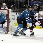 Arizona Coyotes' Antoine Vermette (50) passes the puck as San Jose Sharks' Marc-Edouard Vlasic (44) defends during the second period of an NHL hockey game Saturday, Feb. 13, 2016, in San Jose, Calif. (AP Photo/Marcio Jose Sanchez)