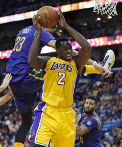 Los Angeles Lakers forward Brandon Bass (2) battles under the basket with New Orleans Pelicans forward Anthony Davis (23) during the second half of an NBA basketball game in New Orleans, Thursday, Feb. 4, 2016. The Lakers won 99-96. (AP Photo/Gerald Herbert)