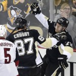 Pittsburgh Penguins' Patric Hornqvist (72) celebrates his second goal of the first period with teammate Sidney Crosby (87) during an NHL hockey game against the Arizona Coyotes in Pittsburgh, Monday, Feb. 29, 2016. (AP Photo/Gene J. Puskar)