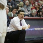 Arizona head coach Sean Miller instructs his team during the first half of an NCAA college basketball game against Washington State, Wednesday, Feb. 3, 2016, in Pullman, Wash. (AP Photo/Young Kwak)