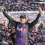 Denny Hamlin celebrates in Victory Lane after winning the NASCAR Daytona 500 Sprint Cup Series auto race at Daytona International Speedway in Daytona Beach, Fla., Sunday, Feb. 21, 2016. (AP Photo/Chuck Burton)
