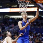 Oklahoma City Thunder's Kyle Singler (5) gets off a shot as Phoenix Suns' Mirza Teletovic, left, of Bosnia, watches during the first half of an NBA basketball game Monday, Feb. 8, 2016, in Phoenix. (AP Photo/Ross D. Franklin)