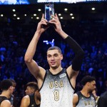 United States player Zach LaVine holds the MVP trophy after the NBA Rising Stars Challenge basketball game in Toronto, Friday, Feb. 12, 2016. (Mark Blinch/The Canadian Press via AP) MANDATORY CREDIT