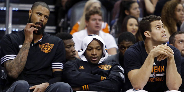 Phoenix Suns' Tyson Chandler, left, P.J. Tucker, middle, and Kris Humphries sit during the fourth q...