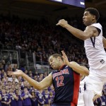 Washington's Marquese Chriss, right, collides with Arizona's Ryan Anderson (12) as the ball flies out of bounds during the first half of an NCAA college basketball game Saturday, Feb. 6, 2016, in Seattle. (AP Photo/Elaine Thompson)