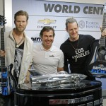 Tyler Hubbard, right, and Brian Kelley, left of Florida Georgia Line pose with International Speedway Corporation president Joie Chitwood III, center, during a news conference before the NASCAR Daytona 500 Sprint Cup Series auto race at Daytona International Speedway in Daytona Beach, Fla., Sunday, Feb. 21, 2016. (AP Photo/Terry Renna)
