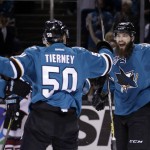 San Jose Sharks center Chris Tierney (50) celebrates his goal with teammate Brent Burns, right, during the first period of an NHL hockey game against the Arizona Coyotes on Saturday, Feb. 13, 2016, in San Jose, Calif. (AP Photo/Marcio Jose Sanchez)