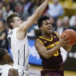 Arizona State guard Tra Holder, right, drives past Colorado guard Thomas Akyazili, center, and forward Tory Miller for a basket in the first half of an NCAA college basketball game Sunday, Feb. 28, 2016, in Boulder, Colo. (AP Photo/David Zalubowski)