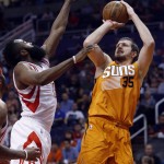 Phoenix Suns forward Mirza Teletovic (35) shoots over Houston Rockets guard James Harden during the third quarter of an NBA basketball game Friday, Feb. 19, 2016, in Phoenix. The Rockets defeated the Suns 116-100. (AP Photo/Rick Scuteri)