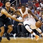 Phoenix Suns guard Archie Goodwin (20) drives past San Antonio Spurs forward Kyle Anderson in the second quarter during an NBA basketball game, Sunday, Feb. 21, 2016, in Phoenix. (AP Photo/Rick Scuteri)