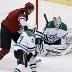 Arizona Coyotes' Martin Hanzal, left, of the Czech Republic, beats Dallas Stars goalie Antti Niemi, right, of Finland, and Johnny Oduya (47), of Sweden, to score a goal during the third period of an NHL hockey game Thursday, Feb. 18, 2016, in Glendale, Ariz. The Coyotes defeated the Stars 6-3. (AP Photo/Ross D. Franklin)
