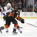 Anaheim Ducks' Mike Santorelli (25) steals the puck from Arizona Coyotes defenseman Oliver Ekman-Larsson (23) during the second period of an NHL hockey game in Anaheim, Calif., Friday, Feb. 5, 2016. (AP Photo/Christine Cotter)