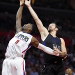 Los Angeles Clippers forward Jeff Green, left, and Phoenix Suns forward Mirza Teletovic, of Bosnia and Herzegovina, reach for a rebound during the first half of an NBA basketball game, Monday, Feb. 22, 2016, in  Los Angeles. (AP Photo/Mark J. Terrill)