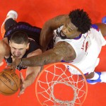 Phoenix Suns center Alex Len, left, of Ukraine, and Los Angeles Clippers center DeAndre Jordan reach for a rebound during the first half of an NBA basketball game, Monday, Feb. 22, 2016, in  Los Angeles. (AP Photo/Mark J. Terrill)