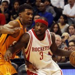 Houston Rockets guard Ty Lawson (3) drives past Phoenix Suns guard Ronnie Price in the second quarter during an NBA basketball game, Friday, Feb. 19, 2016, in Phoenix. (AP Photo/Rick Scuteri)